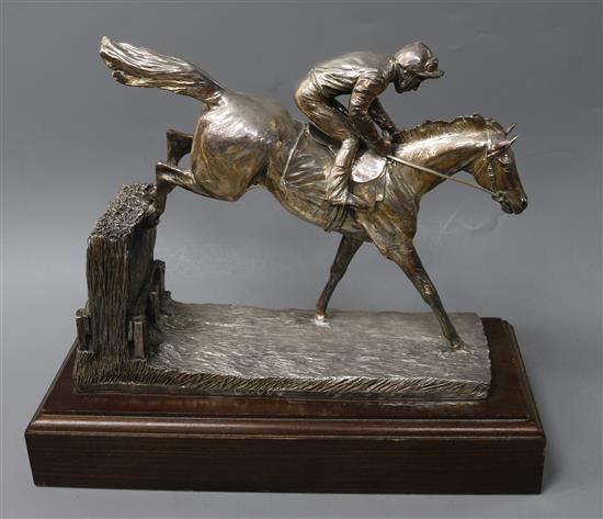 After R. Donaldson- A modern silver overlaid model of a racehorse and jockey jumping a fence, Camelot Silverware Ltd, London, 2007.